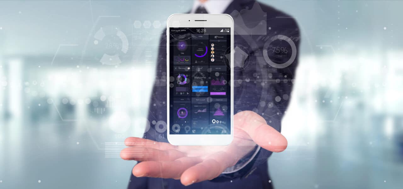 View of Businessman holding Smartphone with user interface data on the screen isolated on a background