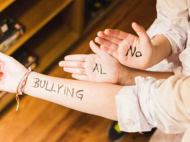 https://focus1.b-cdn.net/wp-content/uploads/2023/03/slogan-against-bullying-written-children-s-hands-640x480.jpg